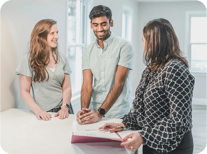Couple talking with realtor