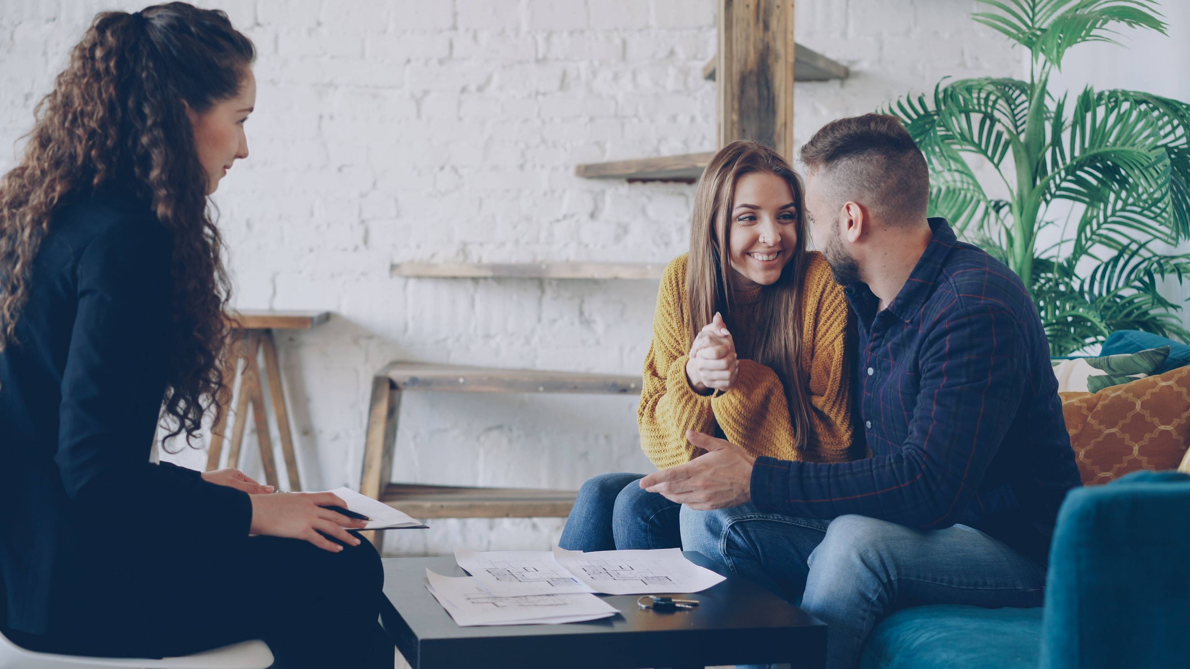 Couple discussing mortgage options with a loan officer