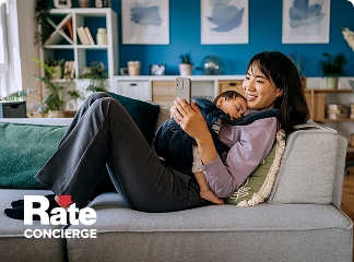 Rate concierge women on her couch on her phone