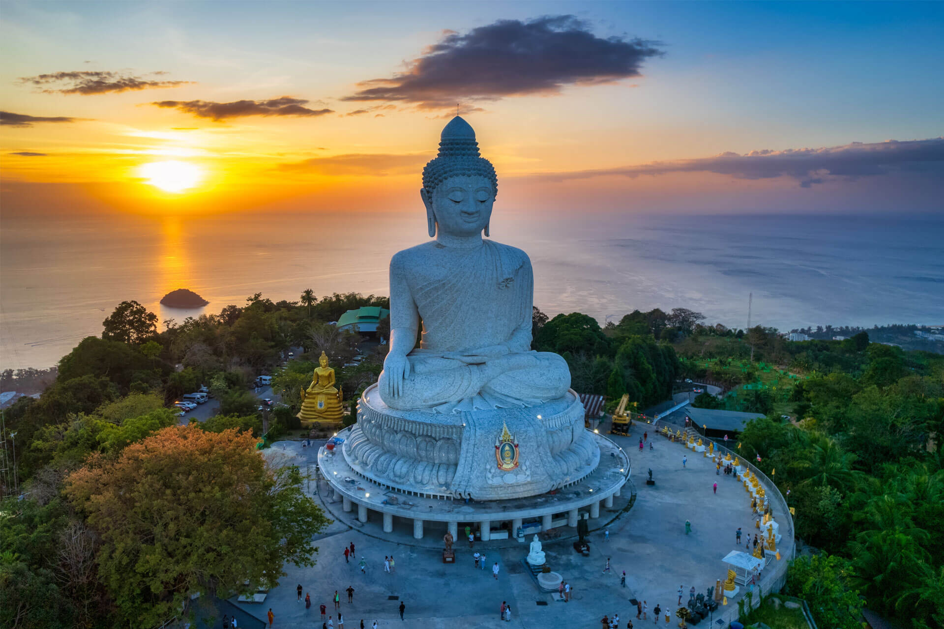 Phuket’s Big Buddha atop a hill with panoramic views of the Andaman Sea at sunset, in Thailand.