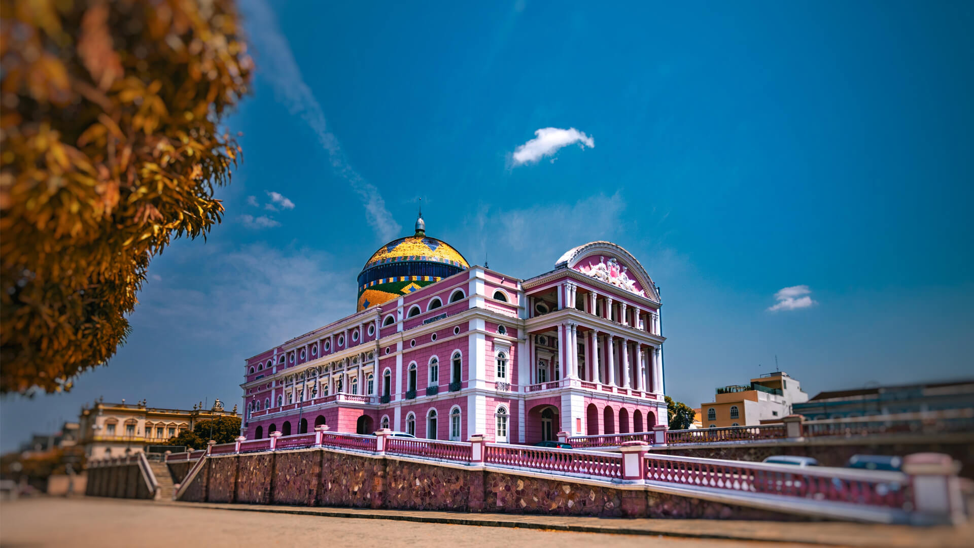Teatro Amazonas in Manaus, Brazil, a neo-Renaissance building with pink façades and a colourful dome inspired by the Brazilian flag.