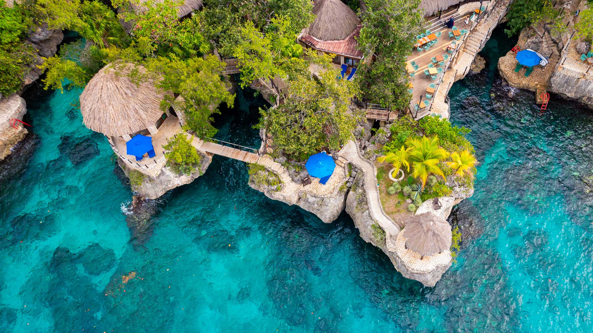 Aerial view of the Rockhouse Hotel in Negril, Jamaica, perched on Pristine Cove’s cliffs overlooking the Caribbean Sea.