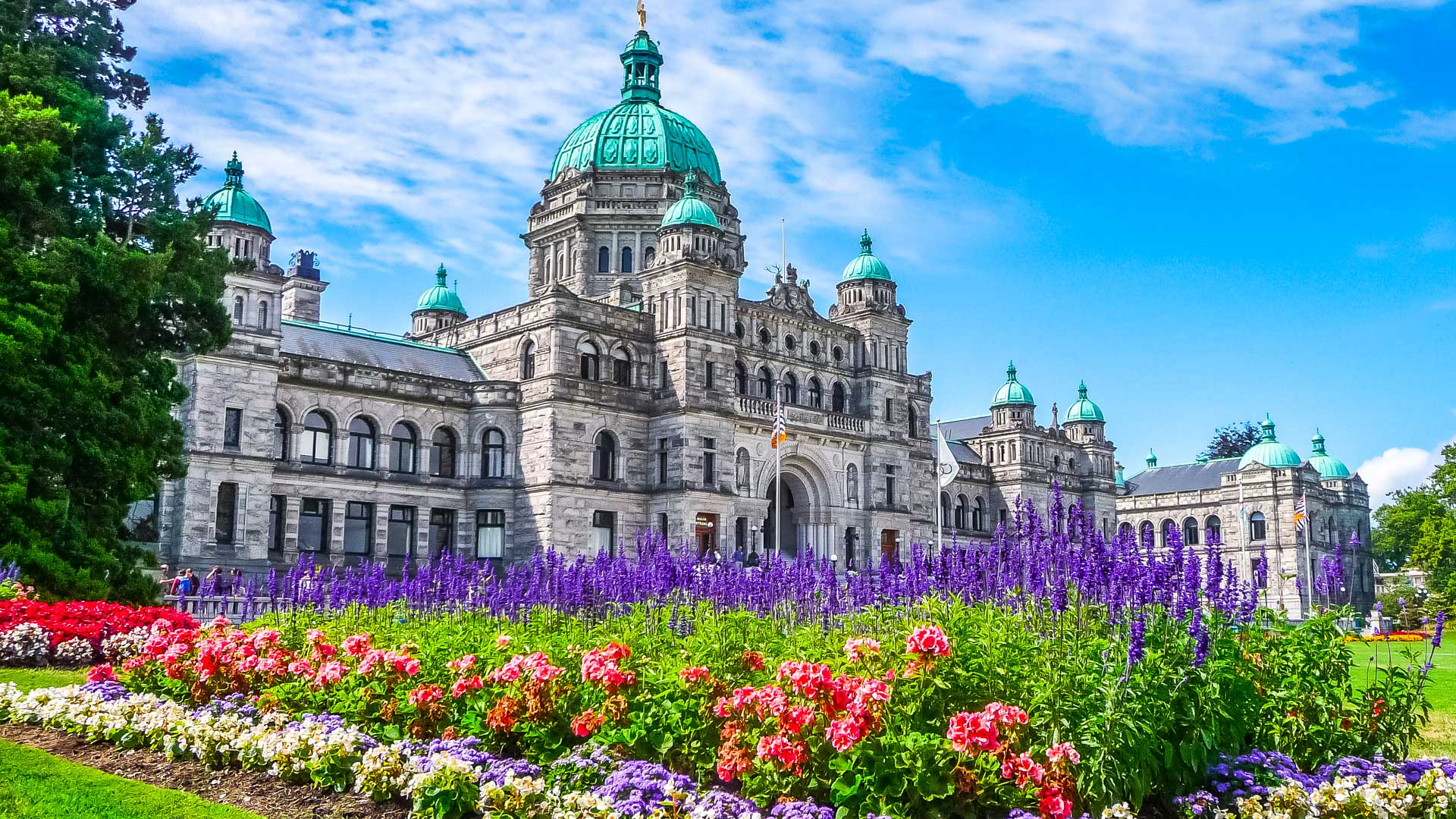 Neobaroque British Columbia Parliament Building in Victoria, with colourful gardens in the foreground.