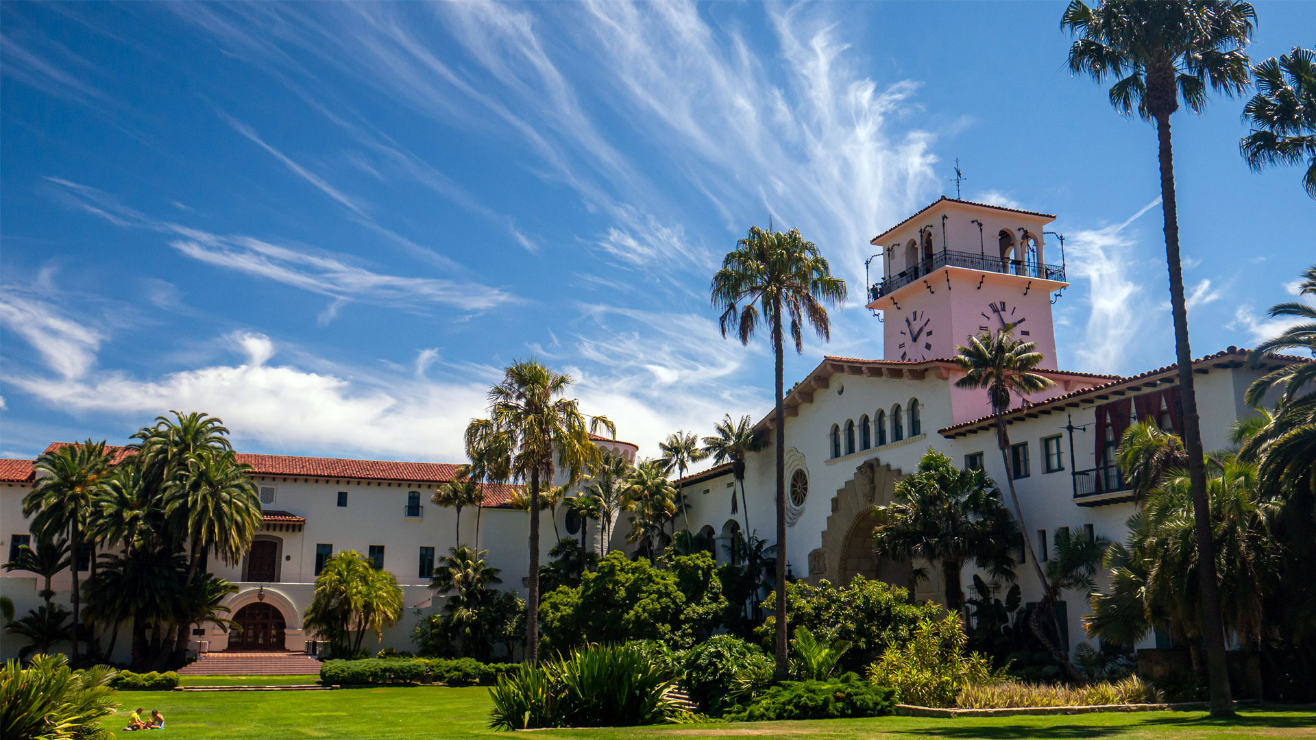 Santa Barbara Courthouse, featuring white buildings and red tile roofs reflecting classic Spanish Mediterranean architecture.