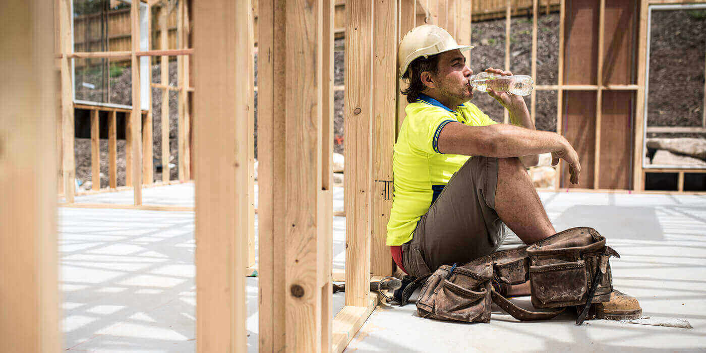 construction worker drinking a water bottle