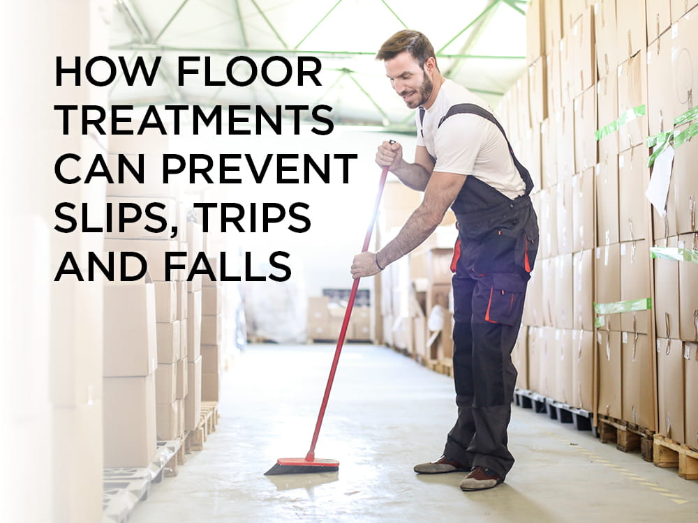 Man sweep floor between pallets