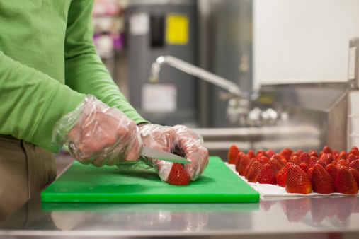 Person cutting fruit