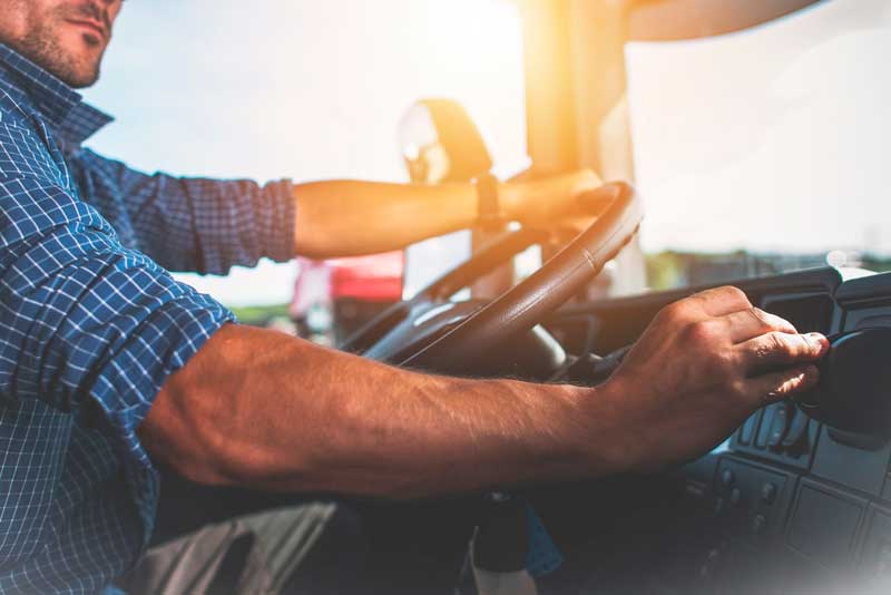 Truck driver shifting gears