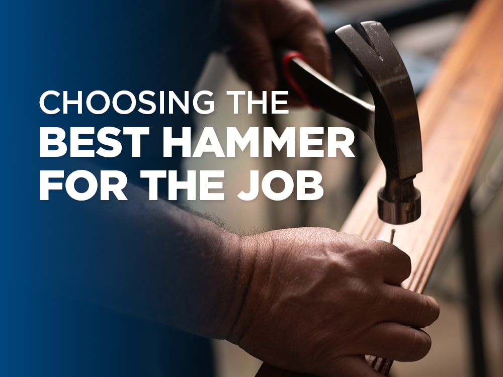 Man hammering a nail into a wooden board