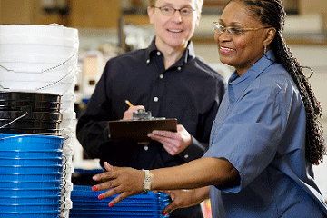 Factory workers discussing something