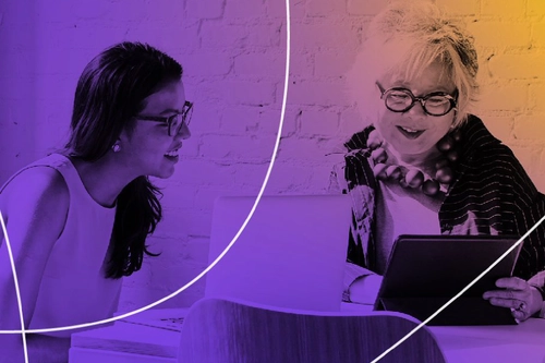 Two women working on computers