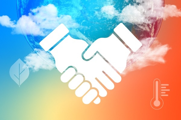 symbolic image showing two hands holding against a rainbow-coloured background
