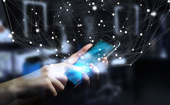 Person on mobile phone with a digital web surrounding their hand.