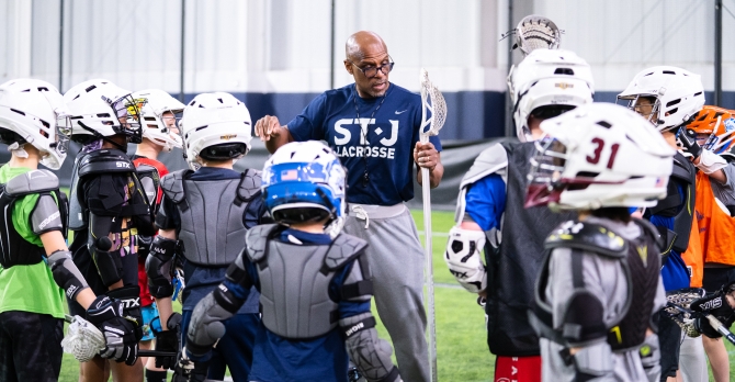 coach-sowell-lacrosse-huddle-335x174.jpg