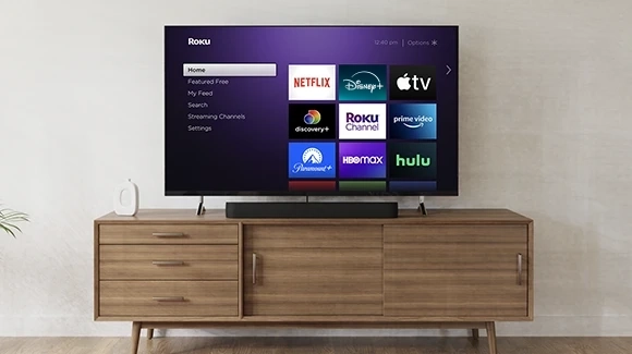 Roku Streambar Pro under a TV with Roku UI screen