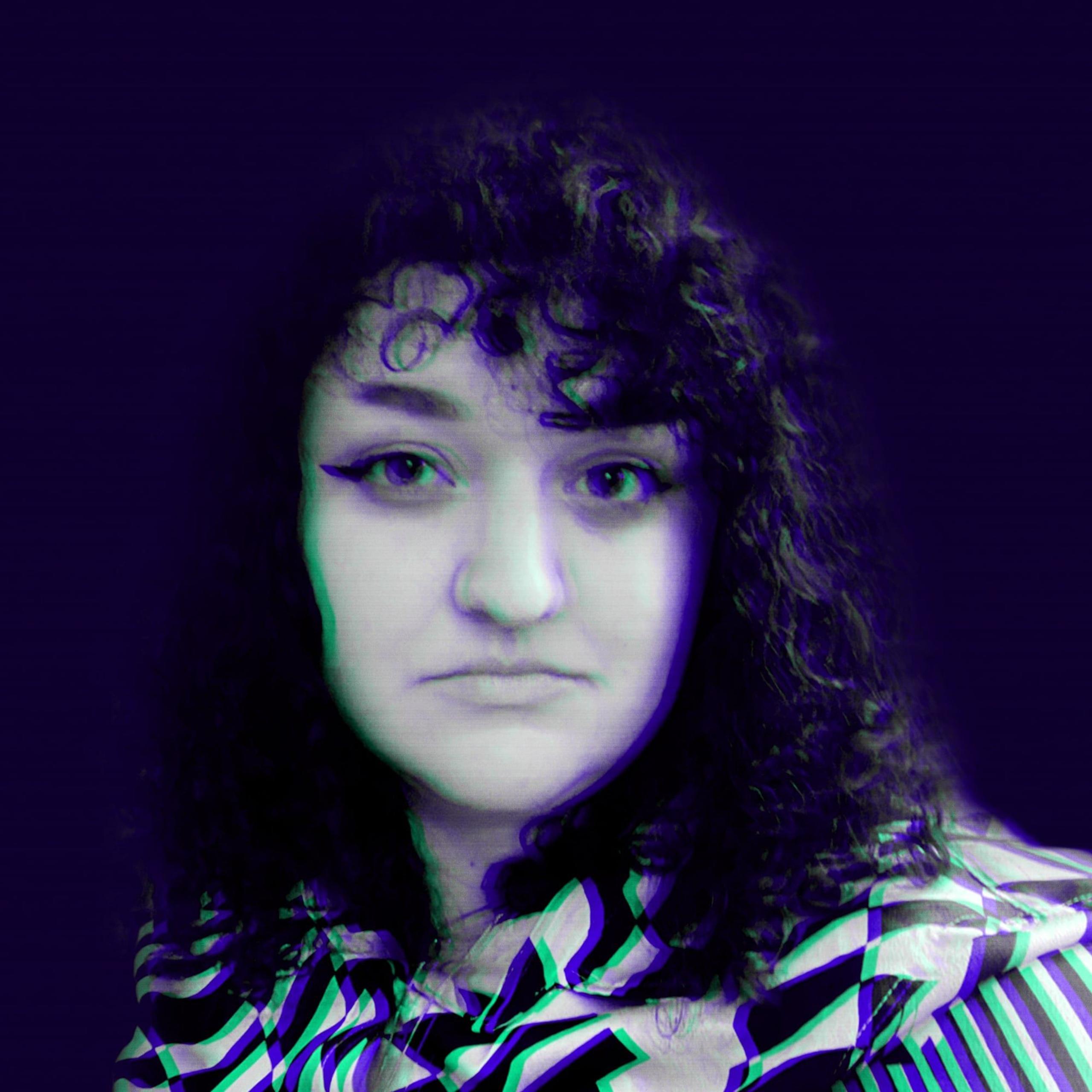 Square portrait of a person with curly dark hair, neutral expression, and purple/green glitch-like edge effects; patterned zigzag clothing at bottom