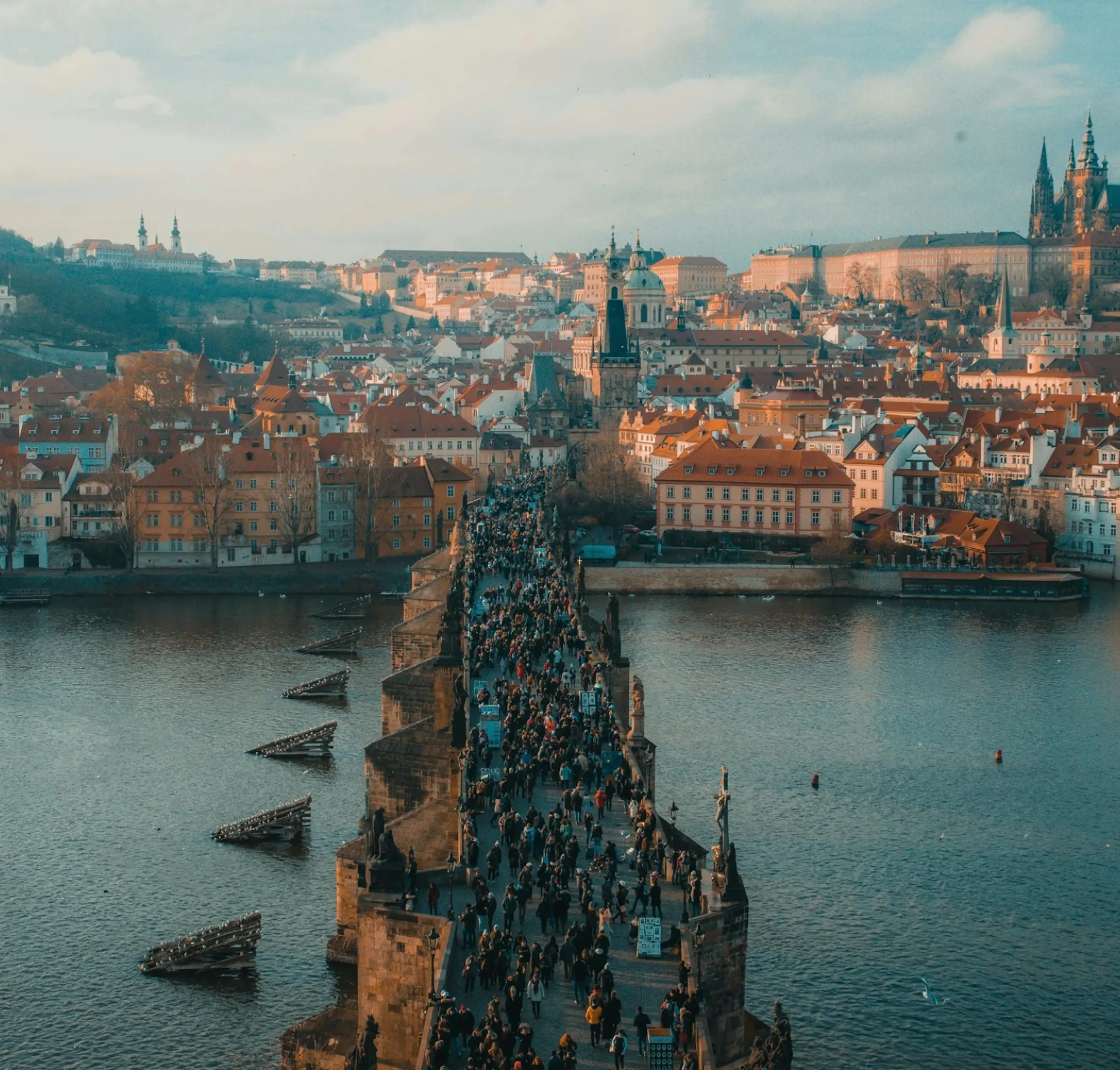 M-08-image-card-prague-aerial-cityscape-water-bridge-people.webp