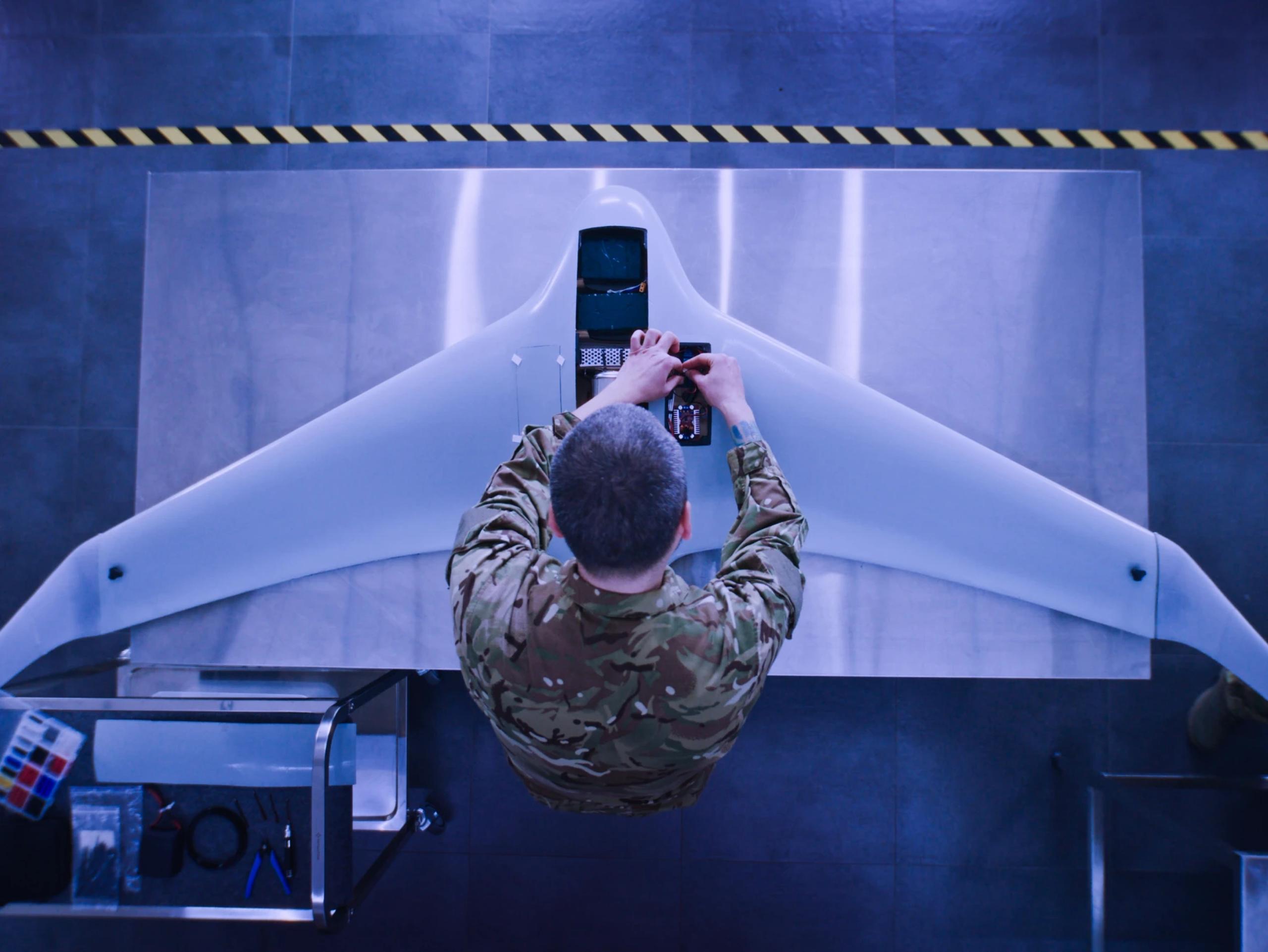 m-11-immersive-federal-government-brand-image-armed-forces-uniform-overhead-drone-maintenance.webp