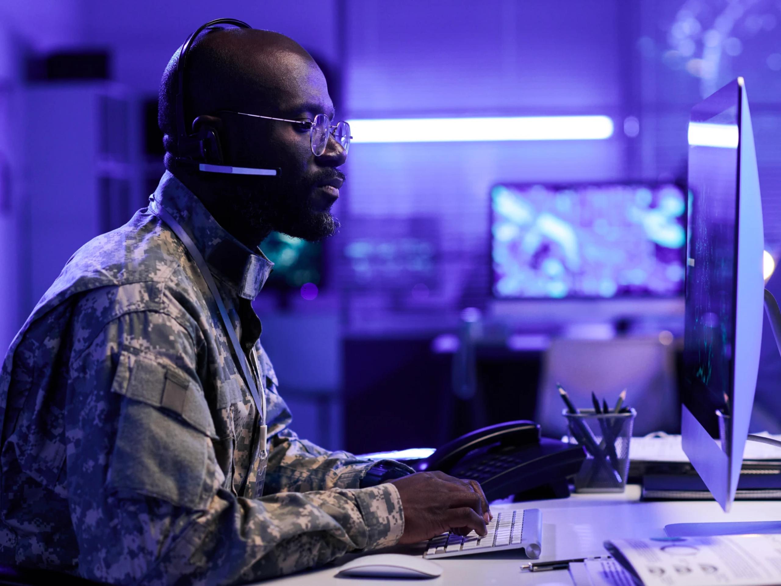 m-11-immersive-federal-government-brand-image-armed-forces-uniform-control-room-desktop-headset.webp