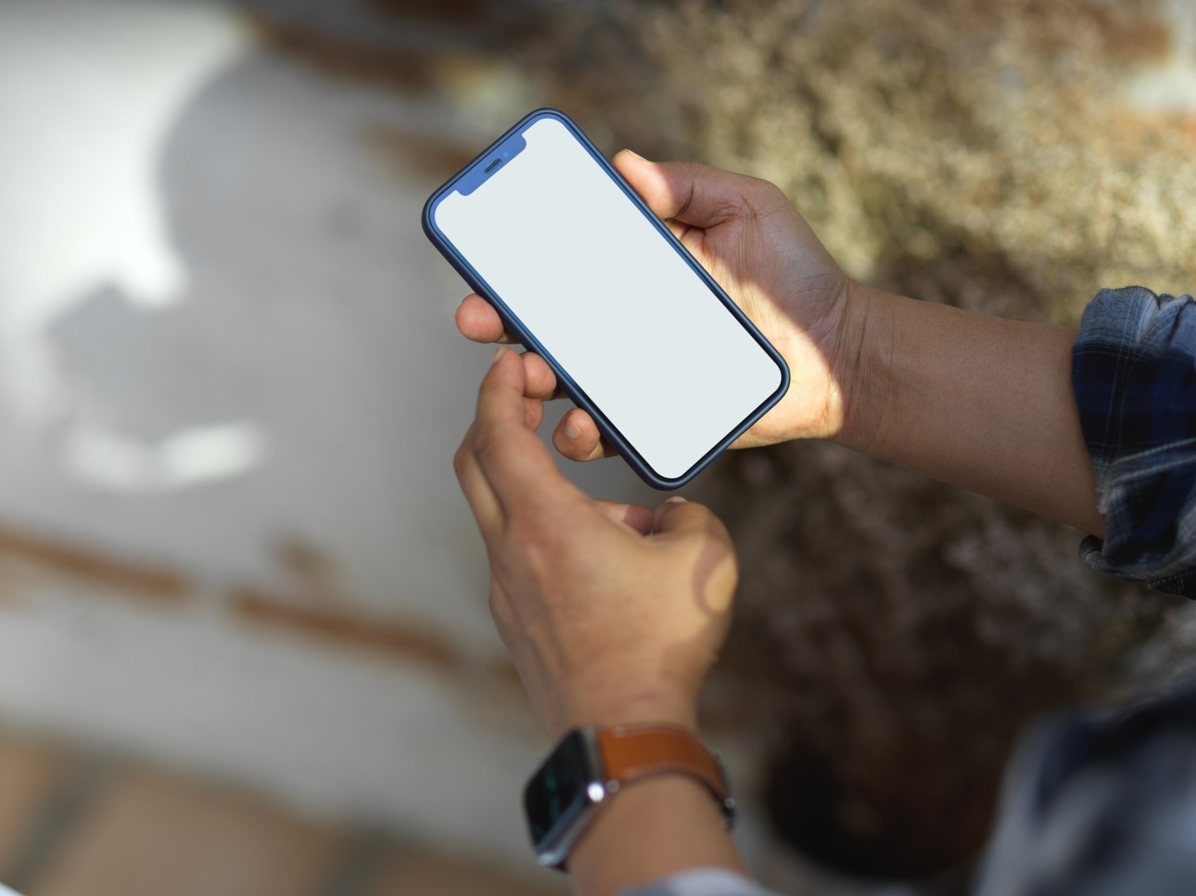 A picture of a person holding an iPhone