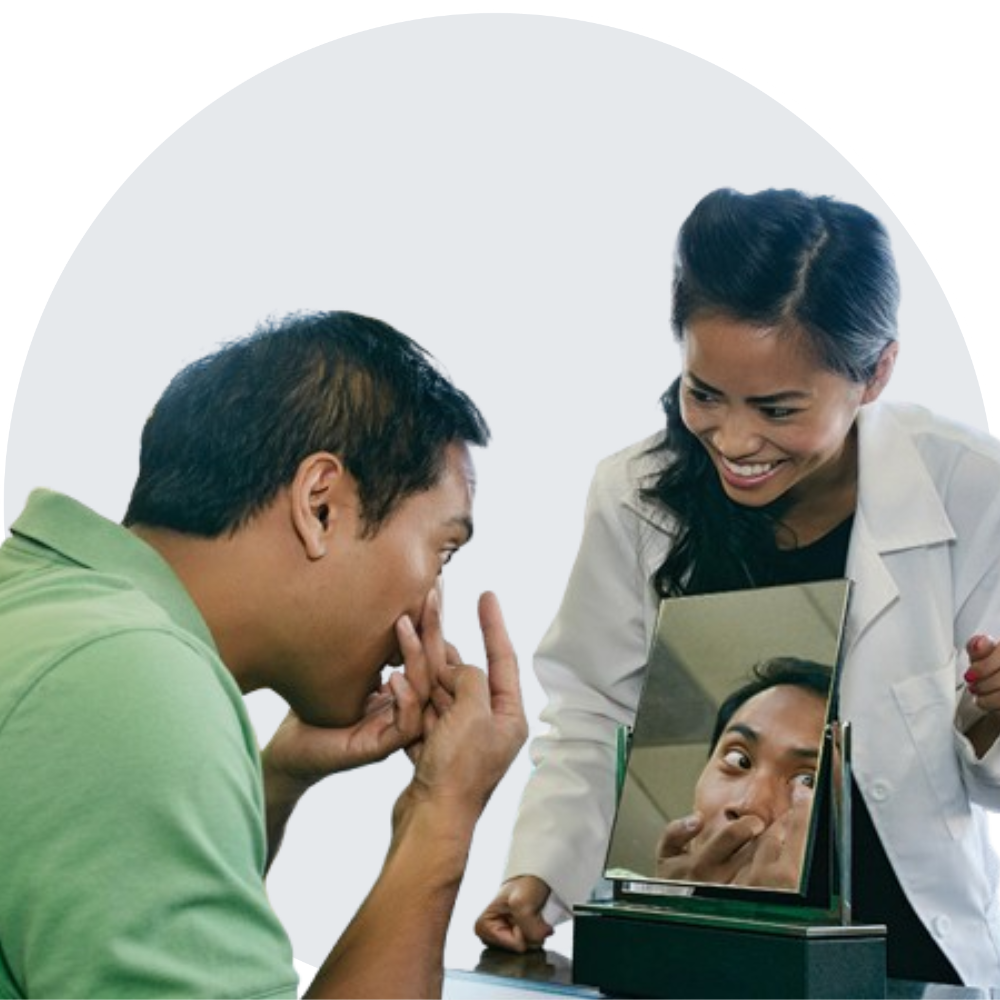 Asian eye doctor guiding patient with contact lens insertion