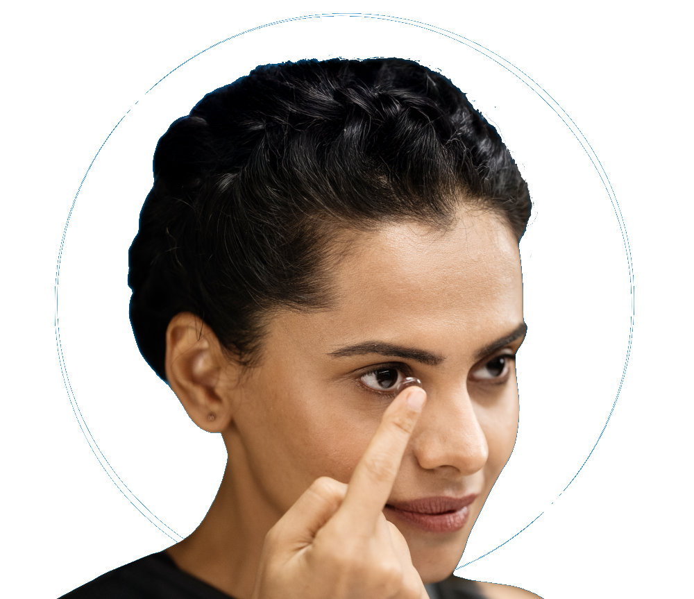 indian woman putting on contact lens