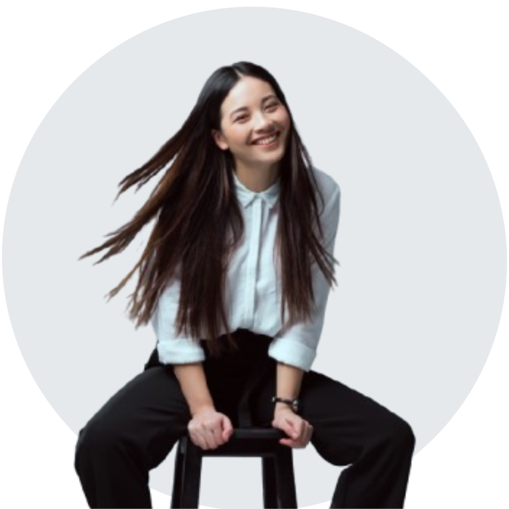 Young woman sitting and looking front of the camera