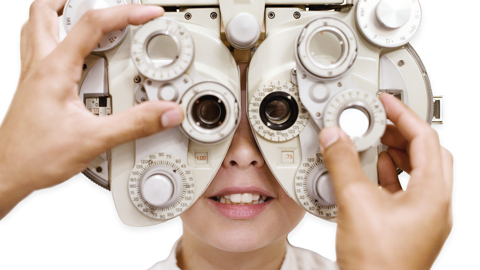 An eye doctor checking vision using a phoropter on a patient.