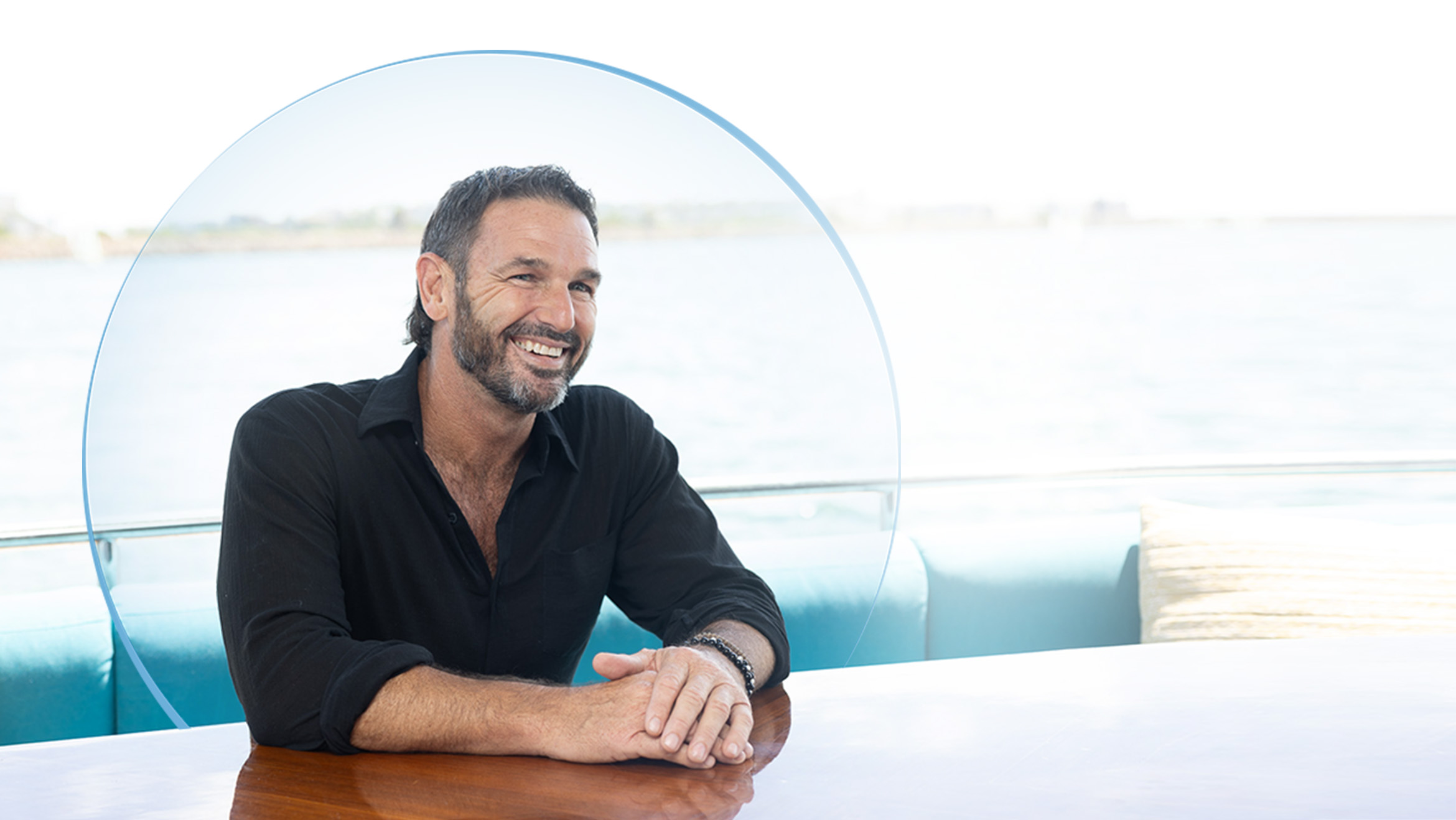 Captain Jason looking off into the distance with a smile Captain Jason from the television show Below Deck looking off into the distance with a smile