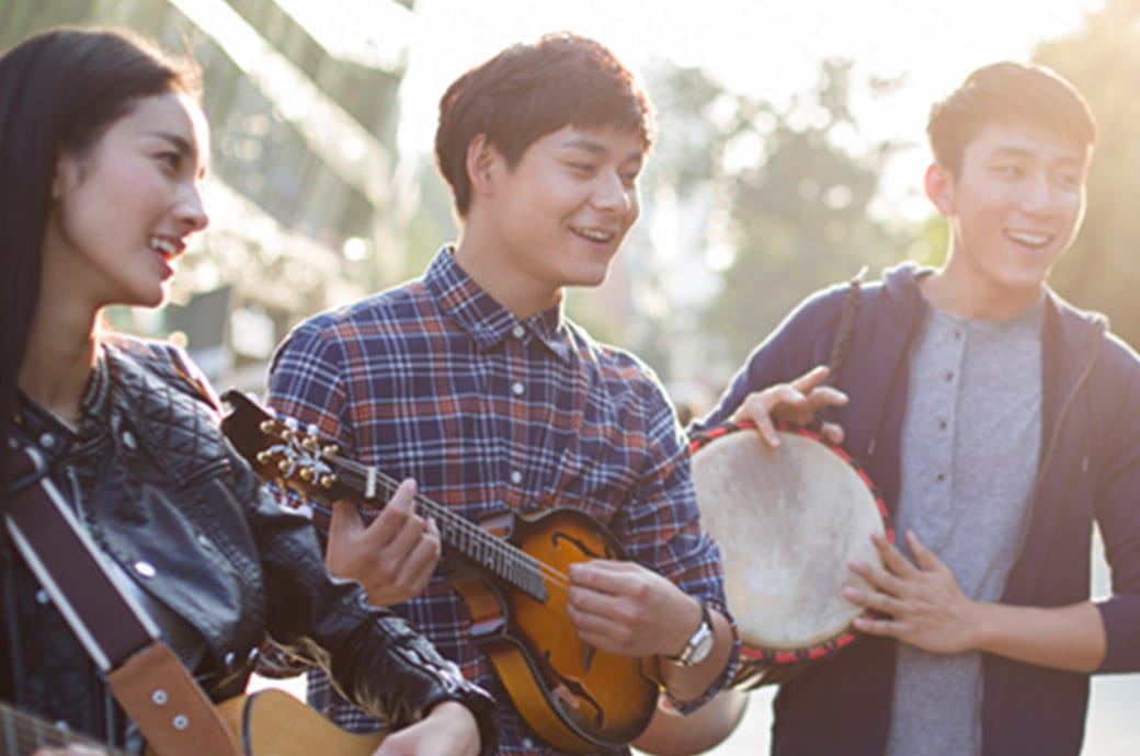  Group of musicians playing their instruments happily