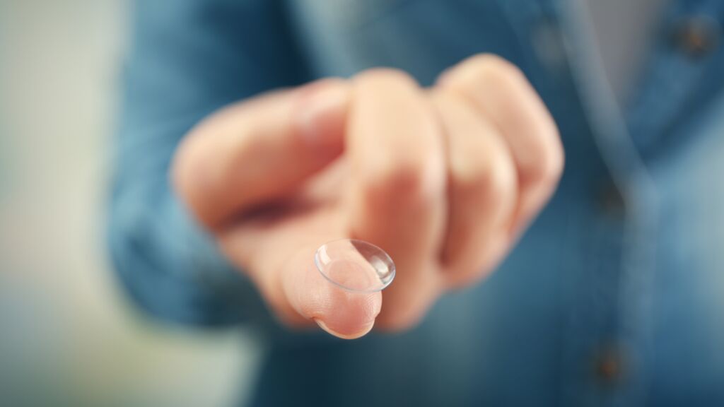 Contact lens on finger Contact lens on finger