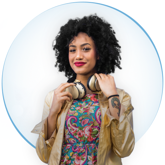 A young woman with curly hair smiling