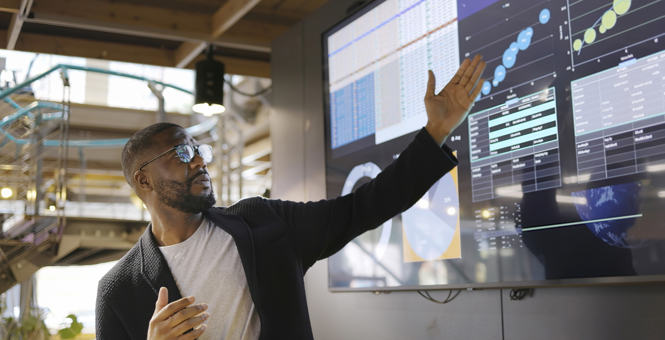 young sales enablement professional using AI technology to improve outcomes