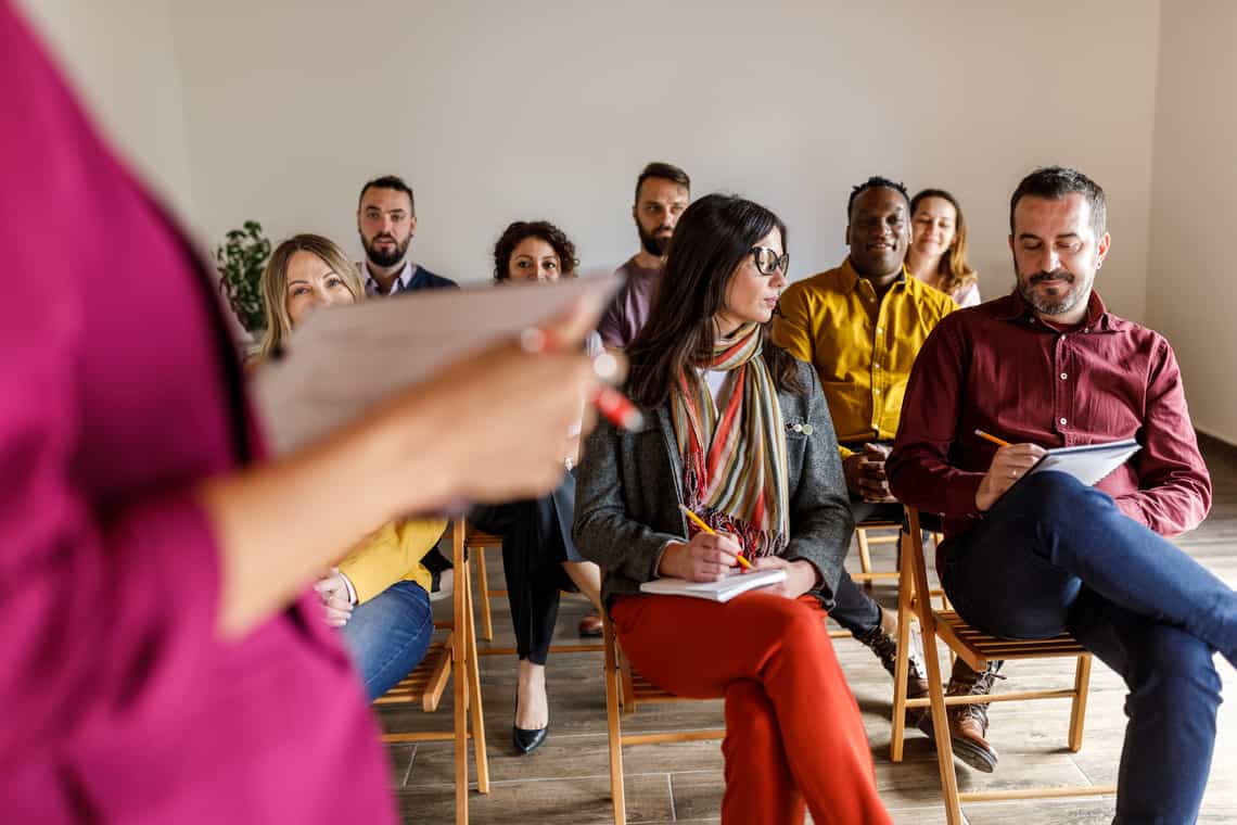 sales team gathered for a meeting to start a sales transformation