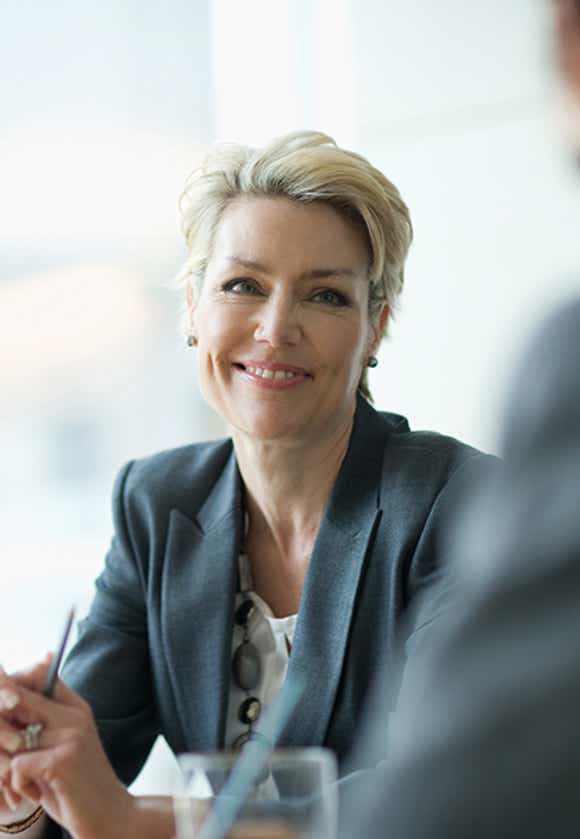 group of stylish sales professionals and their buyers working together using a solution selling methodology to uncover needs and formulate a mutually beneficial solution