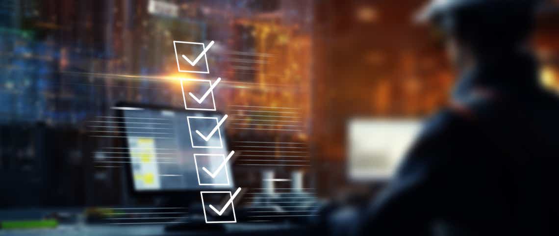 blurry image of a business man sitting at a lap top with prominent checklist overlay to represent the steps to creating a sales funnel