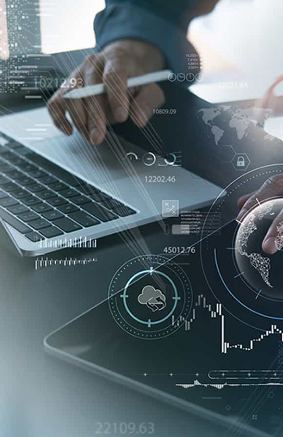 picture of a man's hand working on a laptop with graphics coming out of it that show connectivity between data for measurement and analysis