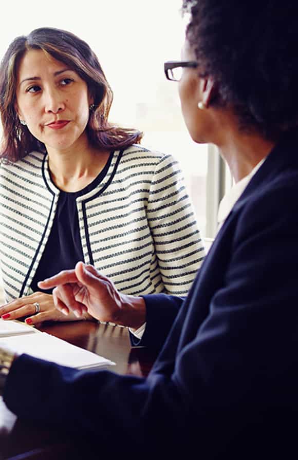 female sales manager addressing a female sales reps individual needs after learning a framework for addressing the different members of her sales team differently.
