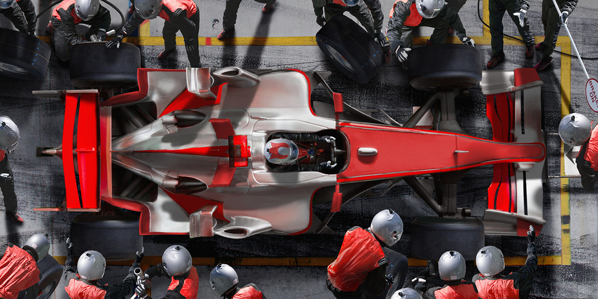 a formula one race car team working in the pit as a metaphor for a sales team delivering high performance outcomes