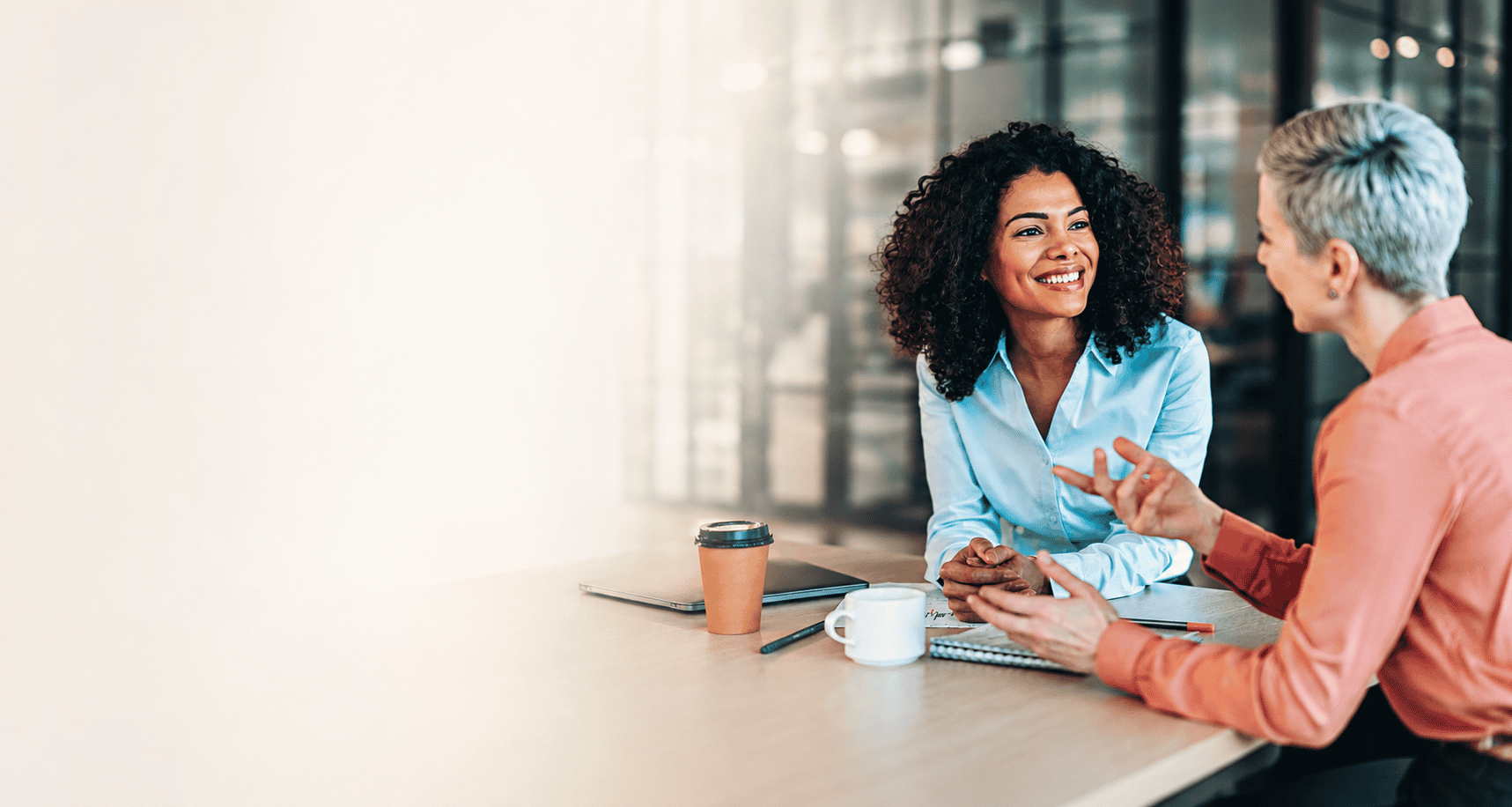 Five colleagues talking around a boardroom table, with a line tracing a path from a tangle of uncertainty to a set of confident outcomes