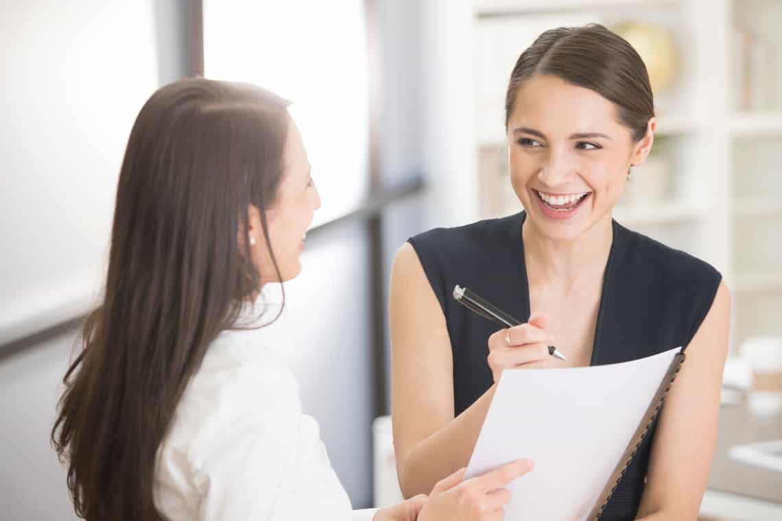a sales manager and her report having an engaging conversation and achieving results because their team has a culture of accountability