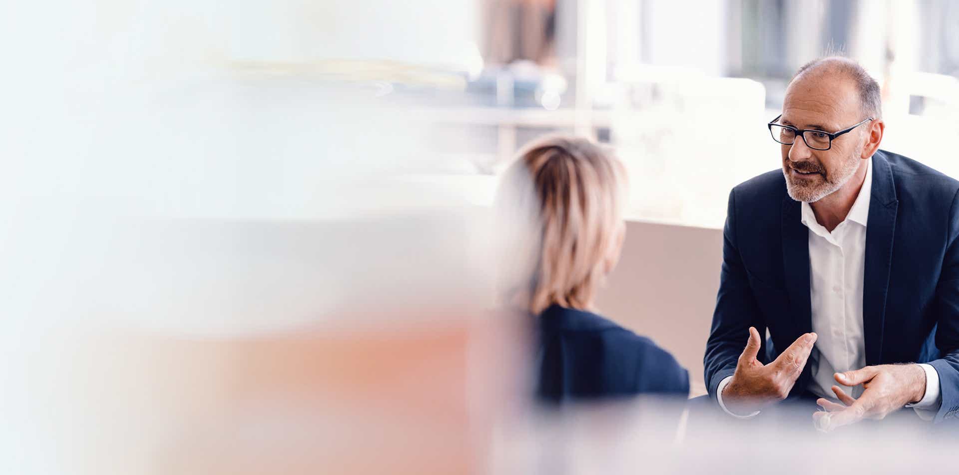 sales manager and sales rep engaged in a coaching session where the sales manager is using the skills they built in the driving salesperson accountability management training program from richardson.