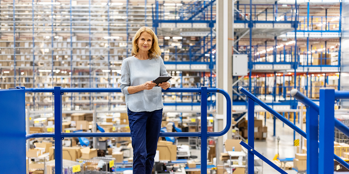 a female sales person in a warehouse using creative strategies to continue selling in the face of supply chain issues