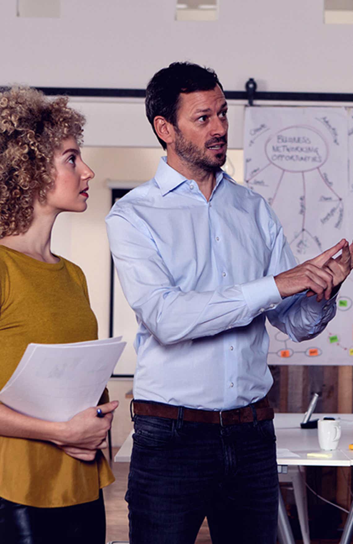 a sales leader coaching his frontline sales manager using skills built in richardson's coaching the coach training program