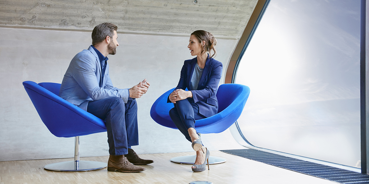 A professional meeting between man and woman demonstrates the focus required to execute a customer-first sales strategy.