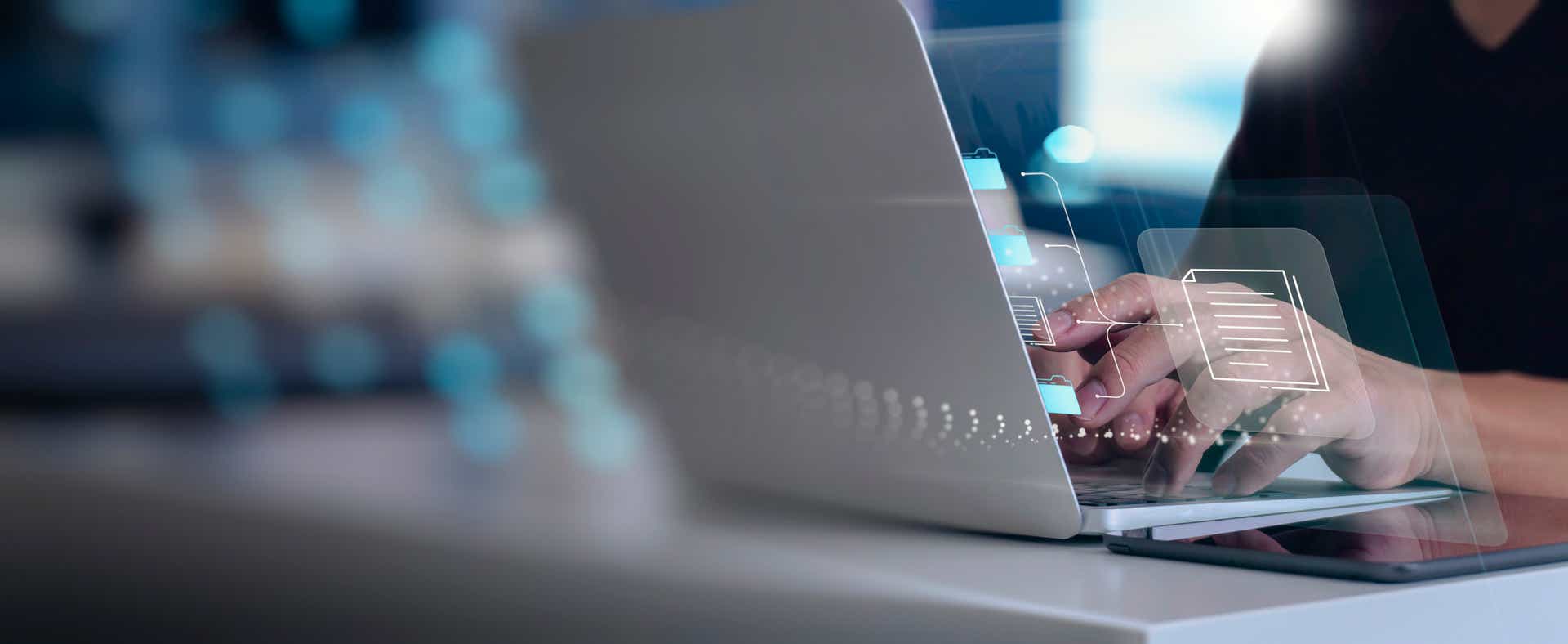 zoomed-in image of a laptop with translucent graphics emanating from it to signify the sales performance dashboard experience.