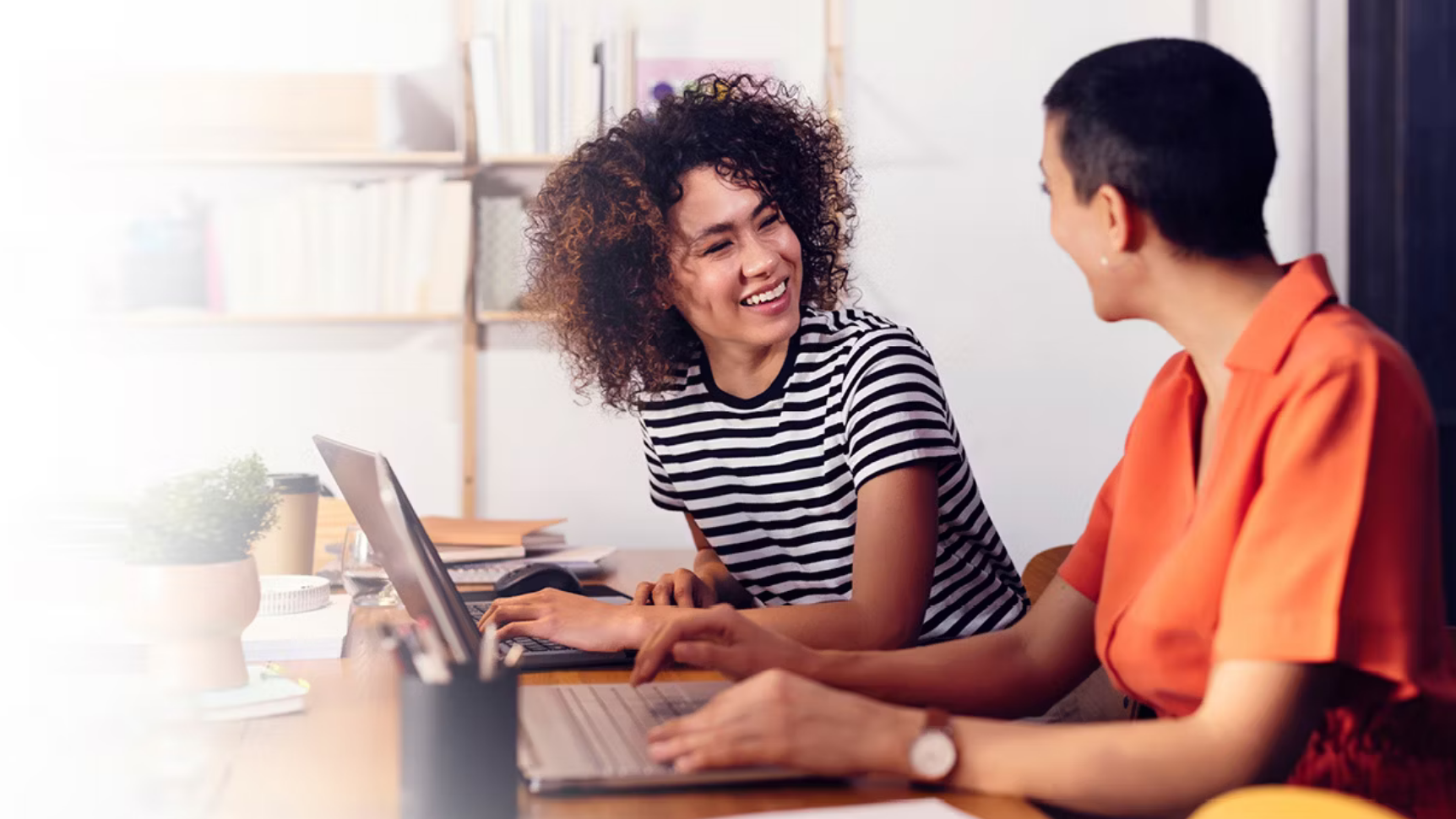 two channel partner managers smiling during a meeting because the channel partner management strategy that Richardson gave them is driving success