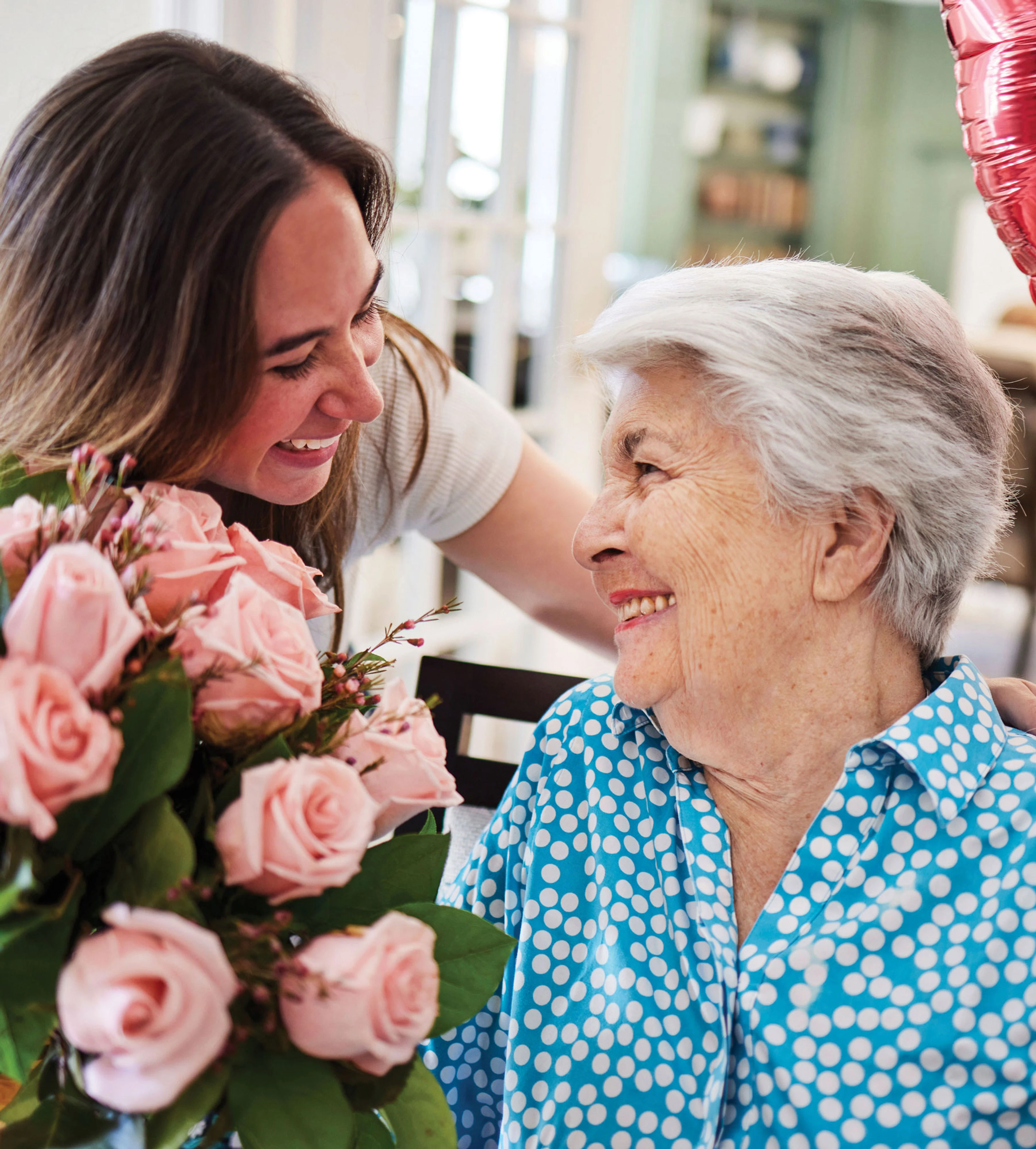 Assisted Living Resident Smiling with Loved One