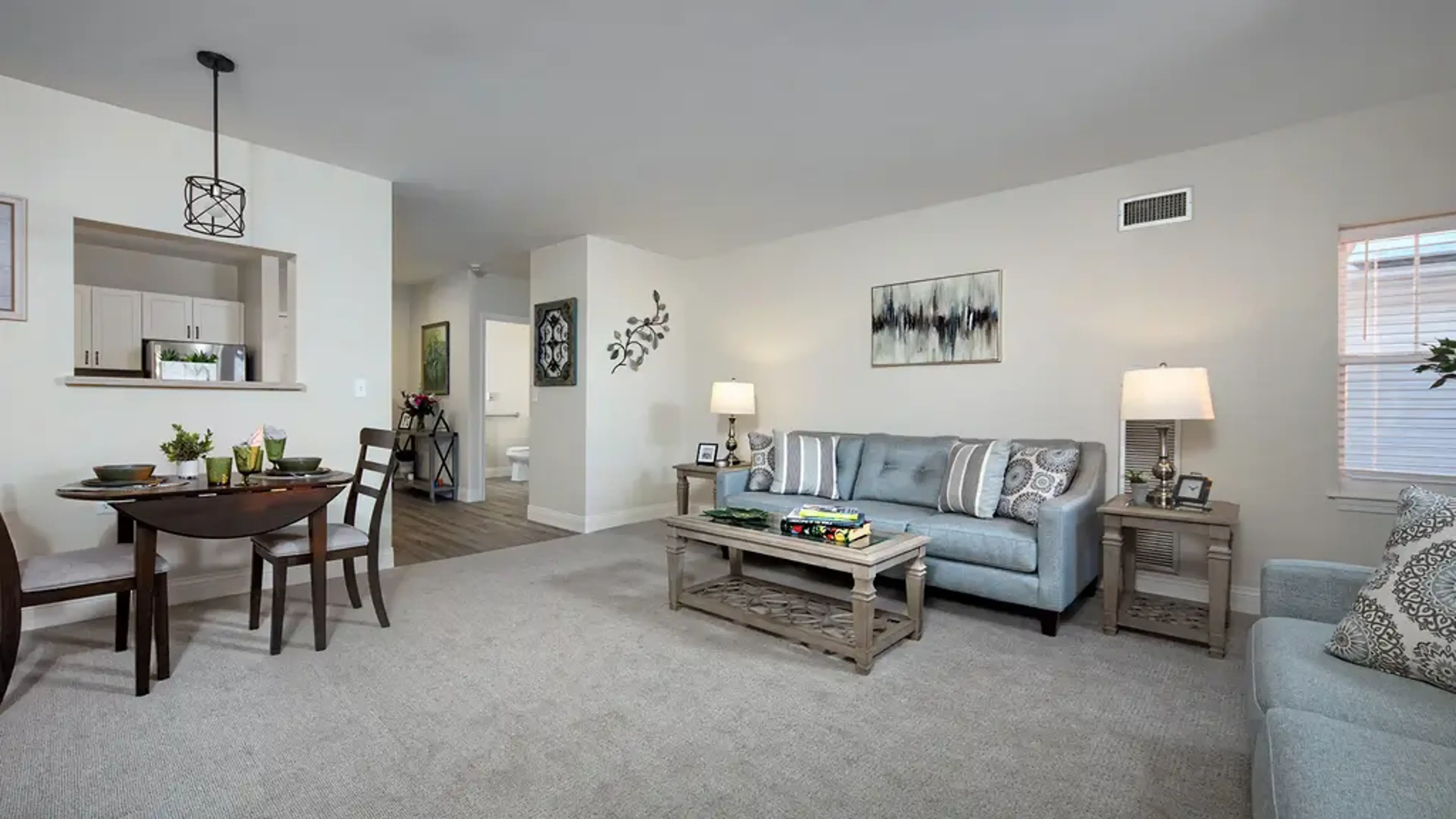 A living room with a couch and coffee table
