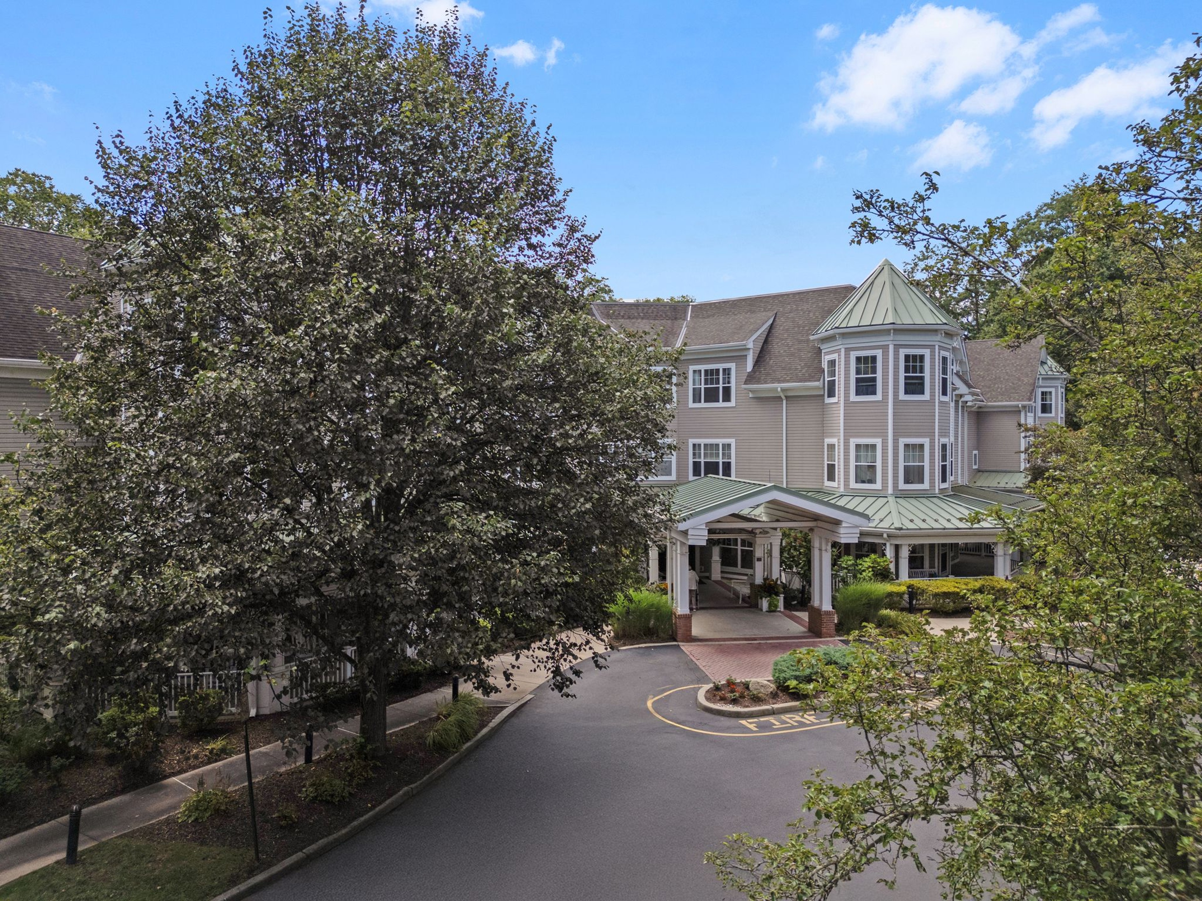 Exterior view of Monarch Paramus with trees
